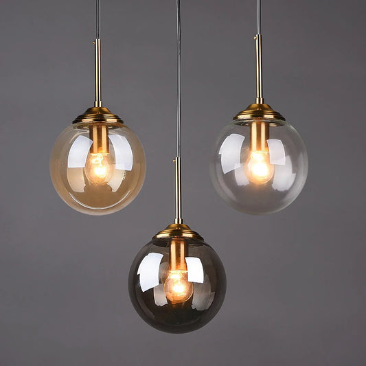 Suspension luminaire design en verre teinté boule Mon Luminaire™